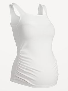 square neckline sleeveless shirred sides for a flexible fit fitted through body hits below belly model is approximately 5'9" and wears a size M (8)Machine wash cold, tumble dry low.  spandex 5% polyester 38% cotton 57% Fitted Sleeveless Tank Top With Ruched Back, Sleeveless Stretch Tops With Ruched Back, Ruched Elastane Tank Top, Stretch Ruched Solid Color Tank Top, Ruched Stretch Tank Top, Sleeveless Elastane Top With Ruched Back, Sleeveless Ruched Back Top, Fitted Ruched Top With Tank Straps, Fitted Ruched Tank Top