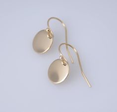 "14K solid gold earrings. 14K solid gold tiny disc earrings. Tiny gold disc earrings. Simple earrings. Dainty earrings. Gift for her. These earrings are simple and can be worn everyday. * 14K solid gold disc is 3/8\", 22 gauge. Please select yellow gold or white gold. * 14K solid gold ear wire The earrings will be shipped in a nice gift box. To see add-on click on the link below. https://www.etsy.com/shop/SashJewelry?section_id=12359884 To see more children's jewelry click on the link below. htt Simple 14k Gold Drop Earrings, Dainty Yellow Gold Circular Earrings, Tiny Modern 14k Gold Earrings, Tiny Modern Gold Earrings, 14k Yellow Gold Circle Earrings, Hypoallergenic Round Earrings In Recycled Gold, Dainty Polished Earrings For Gift, Dainty Polished Finish Earrings For Gift, Dainty Polished Earrings As A Gift