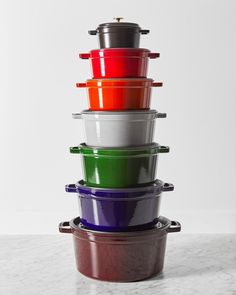 a stack of colorful bowls sitting on top of each other