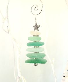 a tree made out of sea glass with a starfish hanging from it