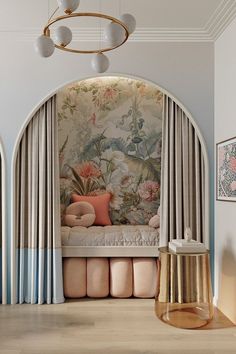 a bedroom with floral wallpaper and curtains on the windowsill, along with a gold stool