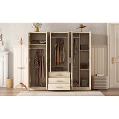 an open wardrobe with drawers and clothes hanging on the door, in a room with white walls