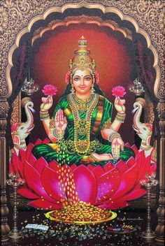 the hindu goddess sitting on top of a lotus