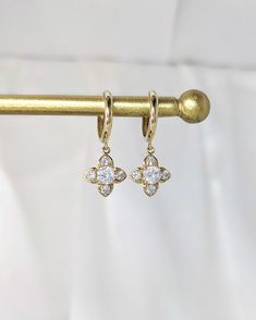 14k Solid Gold Clover Hoop Earrings, Vintage Inspired White Gold Dangle Huggies, Dainty Flower Charm Drop Earrings, 14k Real Gold Huggy, Mom This sparkling and elegant pair of Clover Dangle Hoop Earrings is handcrafted from solid 14k gold and high-grade Cubic Zirconia. Romantic little earrings that are great for yourself or as a gift for your loved ones. ★PLEASE NOTE: A SIGNATURE WILL BE REQUIRED UPON DELIVERY FOR ORDERS OVER $200 (before tax)★ ❤ MATERIALS * 14k solid gold * Choice of gold color Elegant Gold Huggie Flower Earrings, Elegant Hoop Earrings With Flower Charm, Gold Huggie Flower Earrings For Pierced Ears, Elegant Round Hoop Earrings With Flower Charm, Gold Small Hoop Earrings With Flower Charm, Gold Dangle Hoop Earrings With Flower Charm, Small Hoop Earrings With Flower Charm In Gold, Gold Hoop Earrings With Flower Charm, Earrings White Gold