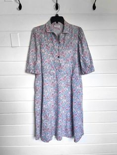 "Vintage All Cotton Women's Dress by Orvis| MADE in USA| Size M/L. * In near perfect condition * Pockets on the sides * Button up * Collared * Vintage Floral Design * missing top button Size tag cut out; approx M/L regular Ptp 21\" Waist 21\" Hip 26\" Length 44\" Sleeve length 16\"" Button-up Cotton Floral Print Dress, Cotton Button-up Dress With Floral Print, Cotton Floral Print Button-up Dress, Relaxed Fit Cotton Midi Dress With Buttons, Cotton Button-up Shirt Dress With Floral Print, Floral Print Cotton Button-up Shirt Dress, Cotton Floral Print Button-up Shirt Dress, Cotton Dresses With Button Closure And Relaxed Fit, Cotton Tunic Dress With Buttons