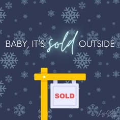 a sign that says baby, it's cold outside and is in front of snowflakes