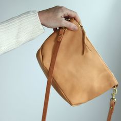 This versatile small beige leather handbag is the perfect bag to travel with on your next trip! It's handmade with vegetable tanned leather and a premium zipper, and has a removable strap so you can also use it as a clutch! This timeless women's bag will become a staple in your capsule wardrobe and is made to last. Leather Clutch Phone Bag For On-the-go, Versatile Pouch With Adjustable Strap For On-the-go, Versatile Satchel With Mobile Phone Pouch, Versatile Leather Crossbody Phone Bag, Versatile Everyday Bag With Zipper Pouch, Functional Everyday Bag With Zipper Pouch, Functional Bag With Zipper Pouch For Everyday Use, Functional Everyday Phone Shoulder Bag, Minimalist Crossbody Travel Bag