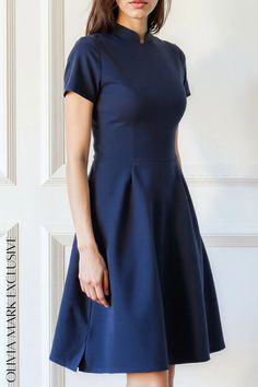 Olivia Mark - Elegant Navy Blue Midi Dress with Flared Skirt and Short Sleeves Fitted Midi Skirt Solid Color, Fitted Dress With Pleated Waist, Fitted Solid Color Dress With Pleated Waist, Blue Fitted A-line Mini Dress, Classic Blue A-line Dress, Fitted Solid Color Dress With Short Sleeves, Blue A-line Dress With Lined Skirt, Fitted Solid Midi Dress With Pleated Hem, Casual A-line Dress With Pleated Skirt