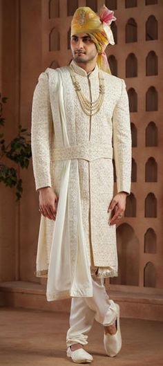 White and Off White color Sherwani in Art Silk fabric with Bugle Beads, Embroidered, Sequence, Thread work Designer Luxury Off White Sherwani, Luxury Off-white Sherwani For Wedding, Luxury Traditional Off White Sherwani, Ceremonial Lehenga With Pallu, White Cutdana Sherwani For Reception, White Bandhgala With Cutdana For Reception, Intricate Embroidery Churidar For Wedding, Off White Traditional Wear With Ceremonial Drape, Traditional Drape Churidar With Resham Embroidery For Wedding