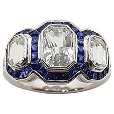 White Sapphire 3.66 carats with Blue Sapphire 2.25 carats and Diamond 0.12 carat Ring set in 18 Karat White Gold Settings Width: 2.0 cm Length: 1.3 cm Ring Size: 53 Total Weight: 7.15 grams "We first opened doors in 1980 when it was then situated in the vicinity of the Victory Monument; a small and modest storefront with a couple of counters. From its humble beginnings to where it stands today, our company has proven its abilities as a jeweler. Since the beginning, we have been supplying fine qu Luxury Gia Certified White Sapphire Ring, White Sapphire Multi-stone Diamond Ring, Classic White Sapphire Gemstone Ring, White Sapphire Platinum Ring In Fine Jewelry Style, White Sapphire Ring Vvs Clarity Fine Jewelry, Fine Jewelry White Sapphire Ring With Vvs Clarity, White Sapphire Ring With Vvs Clarity Fine Jewelry, White Sapphire Ring In Platinum, Platinum Emerald Cut Multi-stone Diamond Ring