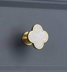 a close up of a door handle with a flower design on it