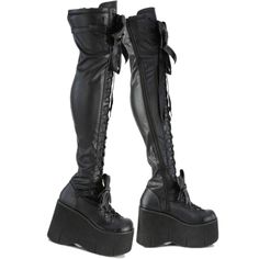 4 1/2" (114mm) Wedge Platform D-Ring Lace-Up Thigh High Boots Featuring Adjustable Straps & Removeable Oversize Bow At Ankle & Thigh Full Length Inner Side Zip Closure Stretch Black Matte Finish Cushioned Foot-Bed Us Woman's Sizes Edgy High-cut Faux Leather Platform Boots, Gothic High Heel Platform Boots For Club, Edgy Fitted High-top Platform Boots, Gothic Knee-high Platform Boots For Club, Black Knee-high Platform Boots For Alternative Fashion, Edgy Thigh High Platform Boots For Club, Fitted Punk Platform Boots For Alternative Fashion, Edgy Synthetic Platform Boots, Gothic Synthetic Boots For Streetwear