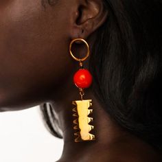 Hand made, attention grabbing ear candy, artisanal processes crafted in Africa. The raw materials for each style are thoughtfully sourced and made from sustainable methods. Recycled glass, gold plated brass and glass beads. 2.5 inches in length  Can be purchased as an asymmetrical unit or matching unit in the drop down Handmade Unique Brass Beaded Earrings, Unique Handmade Brass Beaded Earrings, One Of A Kind Brass Dangle Earrings, Unique Handmade Metal Beaded Earrings, Unique Gold Glass Earrings, Unique Gold Brass Beaded Earrings, Gold Glass Earrings With Dangling Beads, Handmade Fusion Style Gold-plated Earrings, Unique Red Brass Earrings