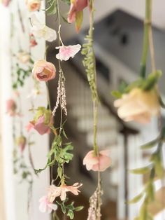 flowers hanging from the ceiling in a room