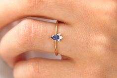 "Sapphire Ring / 14k Natural Sapphire and Diamond Engagement Ring / Genuine Blue Sapphire Promise Ring / September Birthstone Features ✔Made to Order ✔Gold Kt: 14K (also available in 18K) ✔Available Gold Color: Rose Gold, Yellow Gold, White Gold ✔Pear Shape Sapphire: 1 pc 4x3MM ✔Round Diamond: 1 pc 1.7 MM ✔Round Diamond: 2 pc2 1.3 MM ✔Number of Stones: 4 ✔Sapphire CTW: 0.25 ctw ✔Diamond CTW: 0.06 ctw ✔Ready to Ship in 7-10 Business Days If you have any additional questions about this ring, just Blue Birthstone Ring Stamped 14k As Gift, Blue Birthstone Diamond Ring In 14k Gold, Blue 14k Gold Diamond Birthstone Ring, Blue 14k Gold Diamond Ring With Birthstone, Dainty Blue 14k Gold Rings, 14k Gold Blue Diamond Ring, Blue 14k Gold Ring Stamped 14k, Blue 14k Gold Rings For Anniversary, Blue 14k Stamped Promise Ring