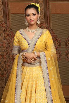 Mango yellow cotton shimmer chanderi lehenga with attached cancan, geometric patterns, intricate gota, dori and badla work and purple broad border. Comes with padded, gota work blouse and coordinating net dupatta. - Aza Fashions Yellow Semi-stitched Sets For Navratri, Designer Yellow Choli For Navratri, Yellow Lehenga With Cutdana And Traditional Drape, Yellow Anarkali Choli With Pallu, Traditional Designer Yellow Lehenga, Yellow Chanderi Choli With Traditional Drape, Designer Yellow Chanderi Choli, Designer Yellow Choli With Gota Work, Designer Yellow Choli With Dupatta