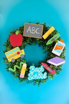 a wreath made out of magnets with the words abc and school written on it