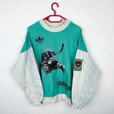 Beautiful vintage Adidas sweater from the 90s. Very rare model. Good used condition. Size approximately M Pit to pit: 60cm Back length: 66 cm Retro Oversized Sweater For Streetwear, Oversized Retro Sweater For Streetwear, 90s Long Sleeve Streetwear Sweatshirt, 90s Style Long Sleeve Streetwear Sweatshirt, Retro White Sweatshirt For Winter, Retro White Winter Sweatshirt, White Retro Winter Sweatshirt, 90s Style White Crew Neck Sweater, 90s Long Sleeve Streetwear Sweater