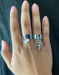 Two rings connected by a chain, decorated with a butterfly and fairy charm. Silver Metal Butterfly Open Ring, Silver Butterfly Open Ring, Silver Open Butterfly Ring, Connected Rings, Rings Butterfly, Double Rings, Fairy Charms, Antique Silver Rings, Handmade Chain