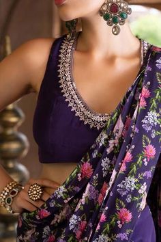 Purple pant saree with floral printed pallu. Comes with embroidered sleeveless blouse.
Component: 2
Pattern: Print and Embroidery
Type Of Work: Floral Print, Dabka and Sequin
Neckline: U neck
Sleeve Type: Sleeveless
Fabric: Crepe; Lining: Shantoon
Color: Purple
Other Details: 
Sequin embroidered neckline
Back cutout with tie up
Closure: Side zip
Occasion: Sangeet - Aza Fashions Luxury Purple Blouse With Resham Embroidery, Unstitched Blouse Piece With Resham Embroidery, Unstitched Resham Embroidery Blouse Piece, Unstitched Sleeveless Blouse Piece With Resham Embroidery, Sleeveless Pre-draped Saree For Diwali, Traditional Sleeveless Blouse With Dupatta, Unstitched Blouse Piece For Diwali, Sleeveless Blouse With Dupatta For Reception, Sleeveless Georgette Blouse For Diwali