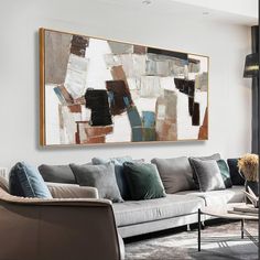 a living room filled with furniture and a large painting on the wall above it's couch