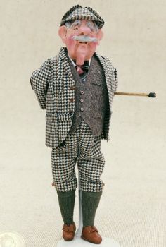 an old man figurine holding a golf club