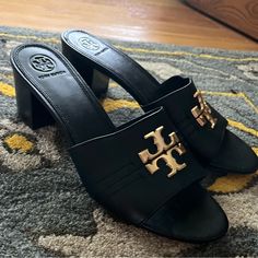 Tory Burch Everly 55mm Leather Heel Block Sandal Size 9 Black Sandals With Gold-tone Hardware For Evening, Black Open Toe Heels With Gold-tone Hardware, Formal Black Sandals With Gold-tone Hardware, Elegant Black Sandals With Gold-tone Hardware, Black Heels With Gold-tone Hardware For Evening, Luxury Tan High Heel Shoes, Elegant Tan Leather Sandals, Luxury Tan Sandals For Formal Occasions, Elegant Black Heels With Gold-tone Hardware