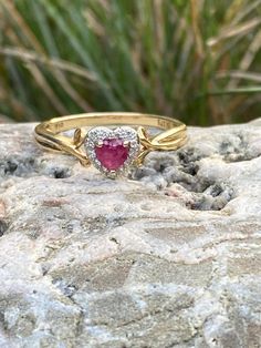 9ct yellow gold heart ring with ruby and diamonds, UK size P, US size 7.75.  Beautiful and delicate, lovely addition to anyone jewellery collection or a gift for a loved one. Gold Ruby Ring For Valentine's Day Proposal, Gold Ruby Ring For Proposal On Valentine's Day, Gold Ruby Heart Cut Promise Ring, Gold Ruby Heart Cut Ring For Promise, Yellow Gold Ruby Ring For Valentine's Day Promise, Yellow Gold Ruby Promise Ring For Valentine's Day, Valentine's Day Promise Ruby Ring In Yellow Gold, Valentine's Day Gold Ruby Diamond Ring, Valentine's Day Yellow Gold Ruby Promise Ring