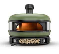 an oven that is sitting on top of a stove with nuts in front of it