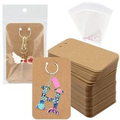 " PLUS SIZE DESIGN--Our cards measure 3 x 4.7 inches / 7.5 x 12 cm. This is the size we've refined and researched to design the best fit for most keychains.PLENTY OF QUANTITY--You will get 100pcs keychain display cards with 100 ziplock bags for easy storage. Sufficient quantities are available to meet the storage needs of various trinkets in your life. In addition to displaying keychains, these cards can also be used to display USB flash disk, necklaces, earrings, hair ties, etc.UNLEASH YOUR DIY Keychains Packaging, Keychain Display, Keychain Holder, Jewelry Display Cards, Jewelry Rack, Card Display, Packaging Supplies, Display Rack, Diy Schmuck