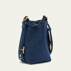 Chloe "Marcie" bucket bag in denim cotton and leather  Chain crossbody strap, 20" drop Drawstring closure  Lining: Leather Approx. 7.4"H x 4.3"W Item Weight (Lbs.): 0.8 Professional cleaning recommended Made in Spain Casual Denim Shoulder Bag With Dust Bag, Everyday Denim Shoulder Bag, Everyday Bucket Bag With Branded Hardware, Casual Crossbody Bucket Bag With Gold-tone Hardware, Denim Bags With Gold-tone Hardware For Everyday Use, Everyday Denim Bags With Gold-tone Hardware, Blue Denim Evening Bags, Chloe Marcie, Denim Cotton