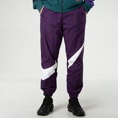 Nike MENS Sportswear Logo Print Tat Ankle Banded Sports Pants Purple AR9895-525 Athleisure Sweatpants With Elastic Side Panels For Sports, Nylon Sweatpants With Elastic Side Panels For Jogging, Sporty Breathable Sweatpants For Streetwear, Nike Sweatpants For Sports, Nike Functional Joggers For Streetwear, Nike Moisture-wicking Joggers For Streetwear, Nike Moisture-wicking Sweatpants, Nike Joggers For Jogging, Nike Moisture-wicking Sweatpants For Sports