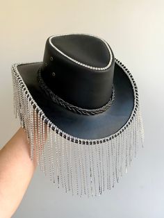 Genuine Leather cowboy hat embellished with rhinestone fringe for the Dollies of the disco The perfect addition to your festival outfits One size: 57cm Hat has an adjustable chin strap Free UK delivery Fancy Cowboy Hat, Festival Fedora Hats With Rhinestones, Western Style Adjustable Hat With Rhinestone Fringe, Western Party Hat With Rhinestone Fringe, Festival Hats With Rhinestones And Short Brim, Festival Hats With Rhinestones And High Crown, Festival Hat With Rhinestones And High Crown, Western Style Party Hats With Rhinestones, Adjustable Festival Hats With Rhinestone Fringe