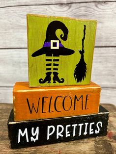 two wooden blocks that say welcome to my pretties on top of each other