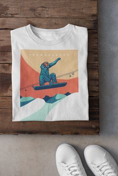 Keywords: UNISEX  Snowboarder T-Shirt ,Vintage Skiing T-Shirt | Ski Lover Hoodie | Skier Sweatshirt, Winter Sports Tee, Asiago Italy Top, Snow Mountain Shirt, Snowboarding Dad Gift Snowboard shirt Ski sweater skier accessories ------------------------------------------------ QUALITY This T-shirt is a UNISEX t-shirt with a vintage illustration and it feels soft and light, with just the right amount of stretch. It features a crew neck, pre-shrunk fabric and side-seamed fit. FIND YOUR SIZE Please find the fitting guide in the pictures to determine your size. Pro Tip: Choose the best size by comparing the measurements of your favorite T-Shirt with the ones listed on the chart. SHIPPING We work with a reliable, high-quality print-on-demand partner with locations in US and the EU, so depending o Ski Hoodie Design, White T-shirt For Outdoor Winter Activities, Casual Graphic Print Tops For Winter Sports, Retro White Winter T-shirt, White Crew Neck Top For Snowboarding, Vintage Skiing, Ski Vintage, Ski Print, Mountain Shirt