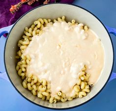 macaroni and cheese is being cooked in a skillet