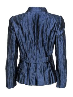 This dazzling piece is sure to turn some heads! Made with metallic silk, this Armani jacket is out of this world. Perfect for wearing with blouses and dress trousers, or over a bodycon dress -- however you wear this stunning piece is sure to add an Italian flair. Size 6 Made in Italy 88% Silk, 18% Metallic silk Front silver-toned button closures Slim fit design Upturned collar neckline Slightly padded shoulders Satin lining Waist 32" Bust 22" Total length 24" Formal Fitted Dressy Blazer, Dressy Fitted Blazer For Formal Occasions, Fitted Dressy Blazer For Formal Occasions, Glamorous Fitted Long Sleeve Blazer, Spring Formal Dressy Blazer, Dressy Long Sleeve Blazer For Work, Winter Silk Blazer For Work, Sleek Fitted Evening Outerwear, Chic Blue Party Blazer