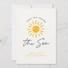 a white card with the words, first trip around the sun and an orange sun on it