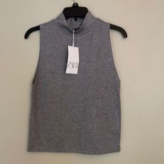 Zara Grey Mock Turtle Neck Sleeveless Sweater. Brand New With Tags. Size Medium. Wide Arm Openings. Perfect Condition. Trendy Gray Sleeveless Tank Top, Gray Sleeveless Crop Top For Summer, Gray Stretch Sleeveless Top, Fitted Gray Vest Top, Casual Fitted Sleeveless Tops, Fitted Sleeveless Casual Top, Trendy Fitted Sleeveless Sweater Vest, Fitted Sleeveless Sweater Vest Casual, Casual Fitted Sleeveless Sweater Vest