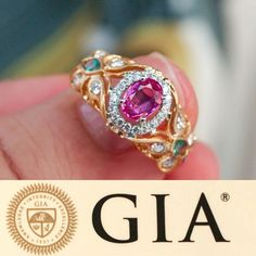 Diamond Rings: Unheated Natural Pink Sapphire Alexandrite Diamond 18k Gold Ring – The Alexandrite. #rings #diamondrings #jewelry #luxuryjewelry Luxury Gia Certified Pink Sapphire Diamond Ring, Exquisite Oval Ruby Ring Gia Certified, Gia Certified Luxury Pink Ruby Ring, Luxury Pink Sapphire Diamond Ring With Gemstone, Luxury Pink Sapphire Ring With Halo Setting, Elegant Gia Certified Pink Sapphire Diamond Ring, Luxury Pink Gemstone With Center Stone, Luxury Gia Certified Pink Sapphire Ring, Fine Jewelry Gia Certified Pink Sapphire Diamond Ring