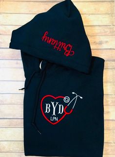 Nurse Monogram embroidered hoodie with name on hood. Title can be added below monogram.  📦FREE PRIORITY SHIPPING 📦 Great gift for any nurse, from graduation, birthday & Christmas gifts! Great quality hoodie, embroidery at an affordable price.  In the notes to seller please list  🪡Monogram in correct order 🪡Title (LPN, RN, etc) 🪡Color of heart 🪡Color of monogram & title 🪡Name on hood 🪡Direction of name on hood  Please see photos for reference & clarification 🧵🪡 Sizing is unisex Fabric: Sporty Hooded Hoodie With Custom Embroidery, Custom Embroidered Fleece Hoodie, Embroidery Designs Hoodie, Nurse Embroidery Designs, Nurse Embroidery, Nursing Jackets, Hoodie Embroidery, Nursing Hoodie, Hooded Baby Towel