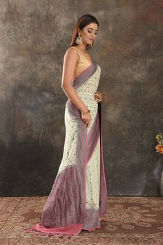 Be vision of elegance on special occasions in this cream georgette sari. The saree is enhanced with antique zari buta and antique zari pink border. It comes with a matching blouse piece. Disclaimer: The shown stitched blouse on the model is for display purpose only. The saree comes with a matching blouse piece and finished with fall and piko. Festive Semi-stitched Cream Pre-draped Saree, Beige Georgette Traditional Wear For Reception, Semi-stitched Cream Saree For Festive Occasions, Cream Pre-draped Saree With Cutdana For Diwali, Cream Cutdana Pre-draped Saree For Diwali, Festive Cream Semi-stitched Pre-draped Saree, Cream Semi-stitched Pre-draped Saree With Zari Work, Semi-stitched Cream Pre-draped Saree With Zari Work, Bollywood-style Cream Pre-draped Saree With Pallu