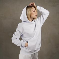 White woman oversized hoodie is an indispensable item in the wardrobe. Can a modern fashionista do without such a thing? Of course, no. You can wear this white hoodie with anything - jeans, skirt, joggers, leggings, shorts or palazzo. The universal white color allows you to combine the hoodie with other clothes of any color. And besides, you will be warm and comfortable. You can go anywhere in this look: for a walk, shopping, traveling, meetings with friends, for sports or just for home.  ---FABRIC--- Due to its breathability, it is a fabric that has minimal sweating properties. It has a texture that can easily be a reason for choice in hot conditions. Due to its natural structure, it does not cause an allergic reaction.Fabric can be  with fleece, which will keep you warm in cool weather. White Hoodie Women, Jogger Leggings, Autumn Hoodie, White Hooded Sweatshirt, Leggings Shorts, White Woman, Jeans Skirt, Hoodie White, Fall Hoodies