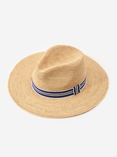 Our Freida Raffia hat is your perfect companion for the beach, horseback riding, or walks around town, or just when you just want an excuse to wear a really chic hat. | J.McLaughlin Women's Freida Raffia Hat Natural/Navy Chic Brimmed Sun Hat For Rodeo, Chic Curved Brim Sun Hat For Rodeo, Chic Fedora With Short Brim For Country Events, Chic Short Brim Sun Hat For Travel, Wide Brim Hat For Travel And Kentucky Derby, Chic Short Brim Hats For Travel, Chic Sun Hat With Short Brim For Travel, Wide Brim Hat For Kentucky Derby Travel, Kentucky Derby Wide Brim Hat For Travel