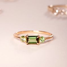 Pastille Tourmaline Ring, Rind Green | Catbird Jewelry Yellow Gold Tourmaline Emerald-cut Ring, Tourmaline Rings With Gemstone Accents And Emerald Cut, Green Tourmaline Ring For May Birthstone, Elegant Three Stone Tourmaline Jewelry, Emerald Cut Tourmaline Ring With Gemstone Accents, Green Tourmaline Multi-stone Emerald Ring, Green Tourmaline Rings With Gemstone Accents, Green Tourmaline Rings With Accent Stones, Green Tourmaline Wedding Rings