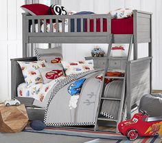 a child's bedroom with a bunk bed and toy cars