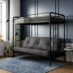 a futon bunk bed in a room with blue walls