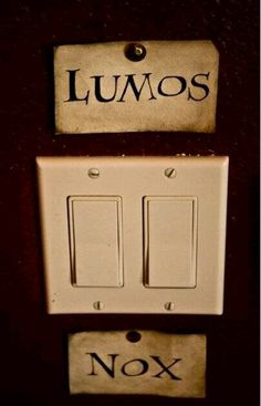 two light switch plates with the words lumos and nox on them