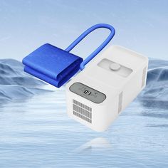 a blue and white device floating in the water