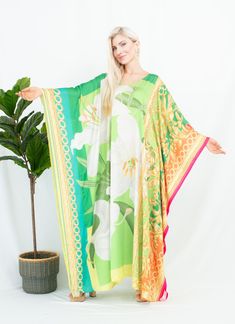 A silk blend kaftan featured the art prints inspired  Renaissance styles with lilies and the art frames, will be perfect for your holidays stay and to any occasions you attend. It's totally smoothly flowy, soft and gentle touch. FEATURES - Green, White, Yellow - Lilies Floral, and Rococo art frame - Personal Custom Made - Full Length Kaftan Long Sleeves - Designer Silk Kaftan - Plus Size and Custom Length - Resort Wear, Beach Wear, Maxi Kaftan Cruise Wear, Vacation Caftan - Boat Neck Kaftan - Po Green Bohemian Kaftan With Floral Print, Green Long Printed Kaftan, Green Bohemian Kaftan With Vibrant Print, Green Floral Print Maxi Kaftan, Green Printed Kaftan With Kimono Sleeves, Green Printed Free Size Kaftan, Green Printed Free-size Kaftan, Long Floral Print Patterned Kaftan, Long Patterned Kaftan With Floral Print